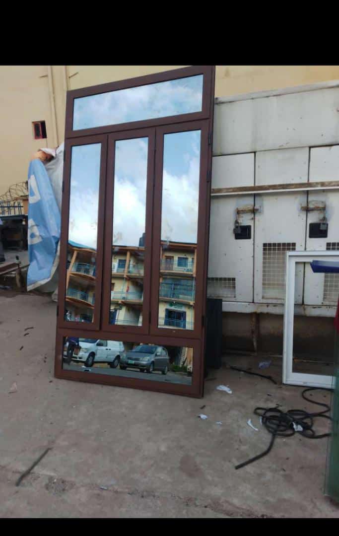 Brown-finish aluminium door and window frame with glass panels