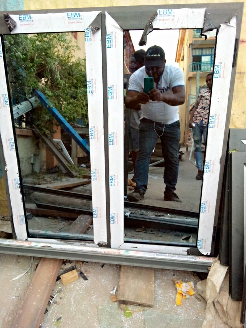 OSAFURE team member checking a large white aluminium frame