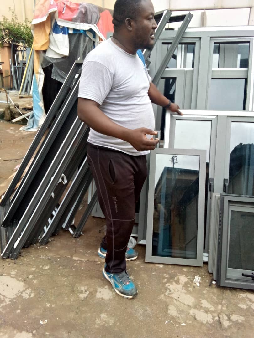 OSAFURE team member with finished aluminium windows