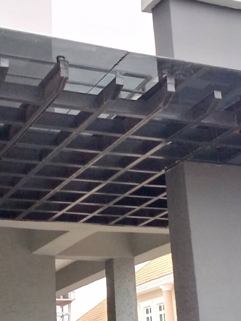 Glass canopy on a steel grid frame between columns