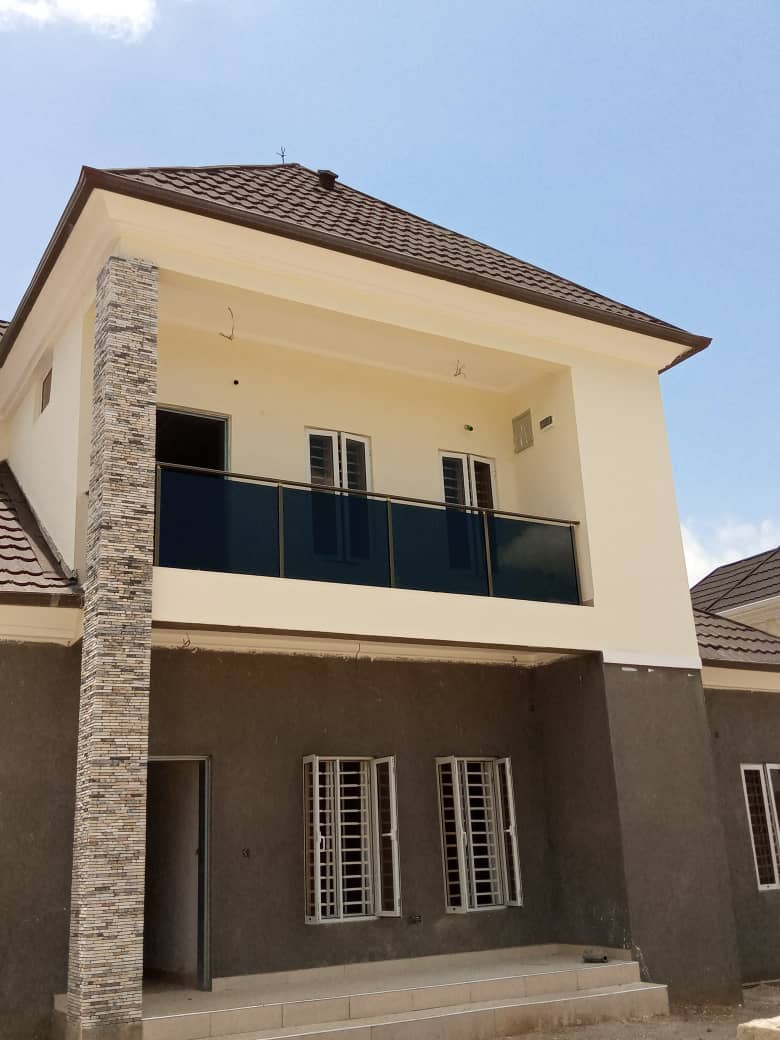 Two-storey house with a glass balcony on the upper floor