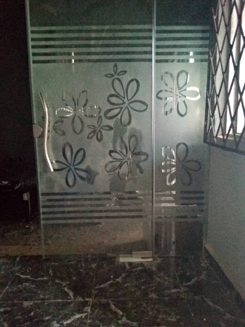 Frosted glass door with an etched floral pattern