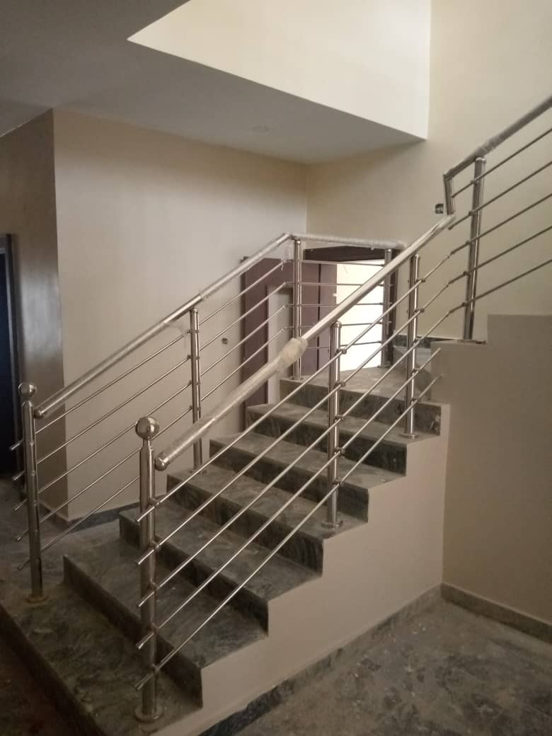 Stainless-steel staircase railing with horizontal rods