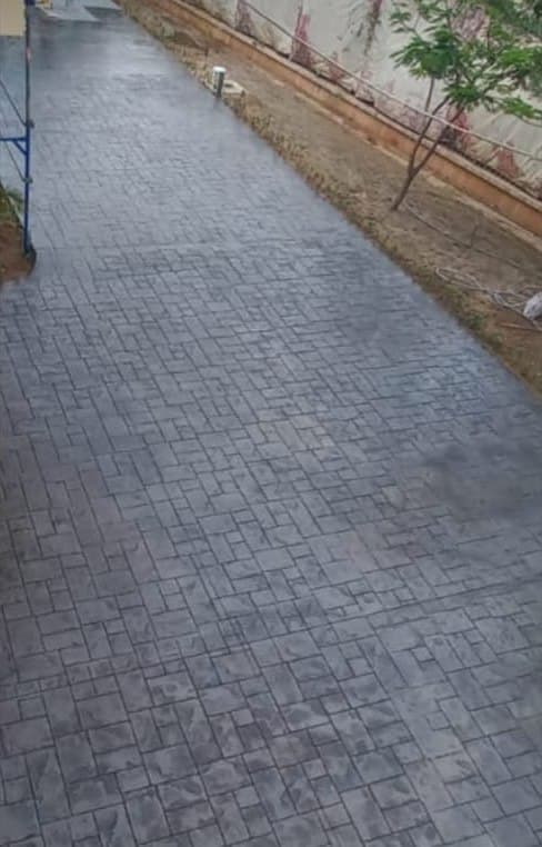 Long grey stamped concrete walkway