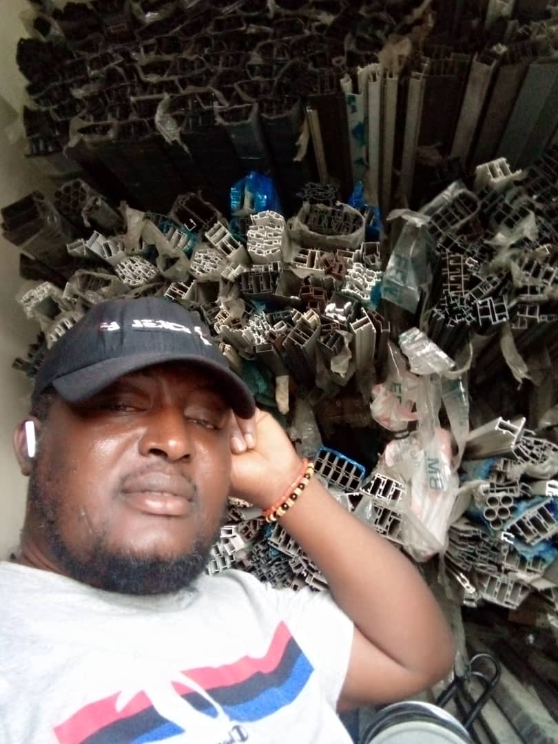 OSAFURE team member in the aluminium profile store