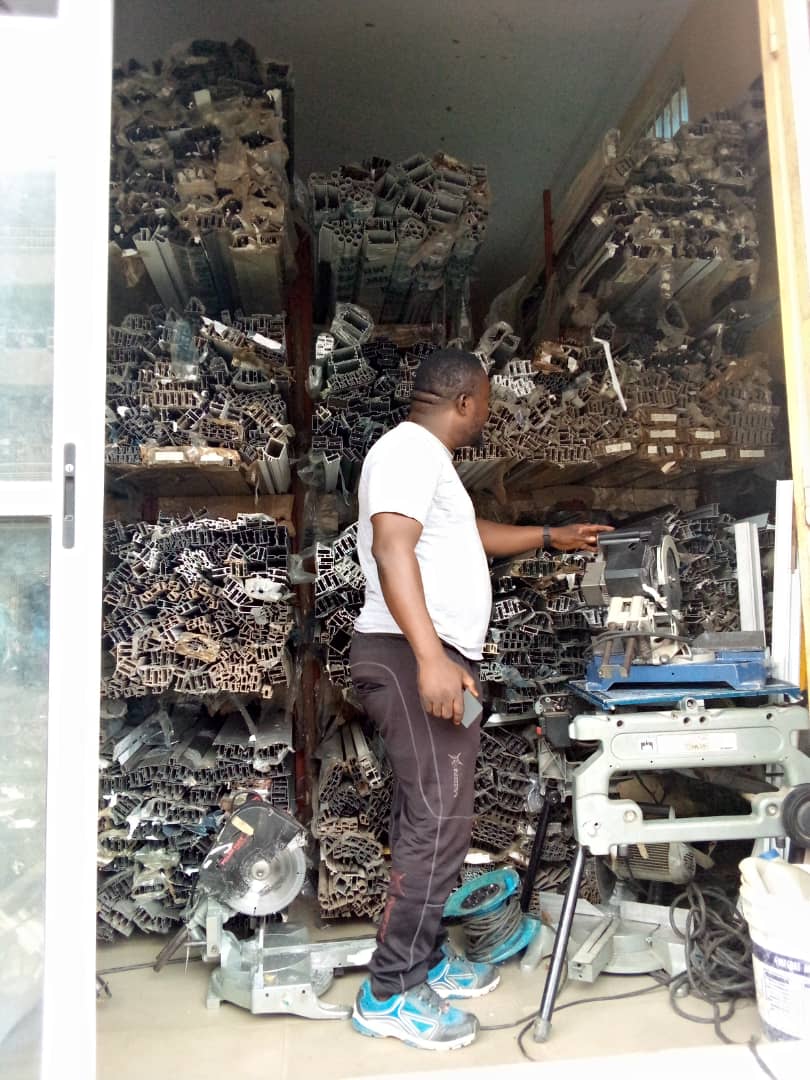 OSAFURE team member at the cutting machine in the workshop