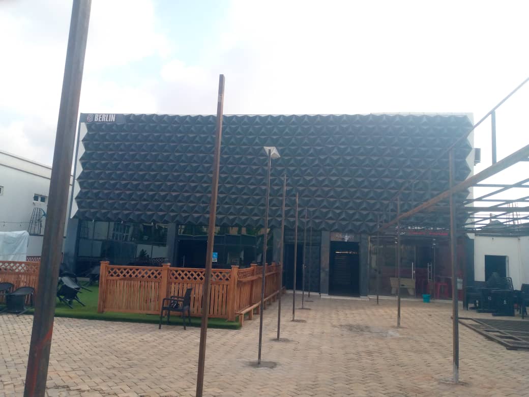 Building front with dark patterned cladding