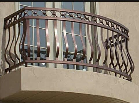 Curved bronze-finish balcony railing