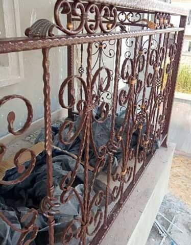 Ornate bronze-finish wrought-iron railing panel